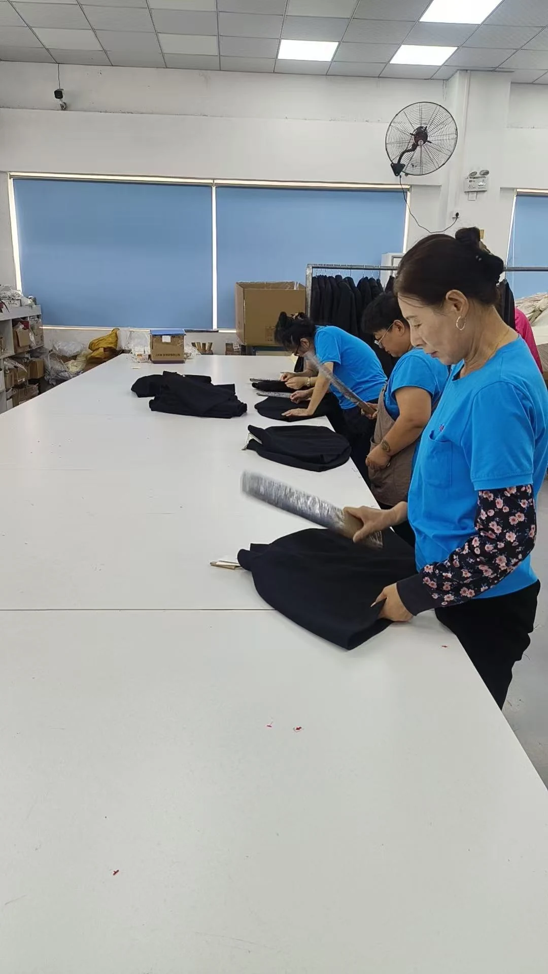Team member working on garment details